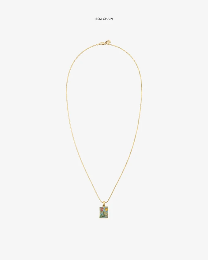 Pendentif en forme d’écusson en vitrail en or 14 carats