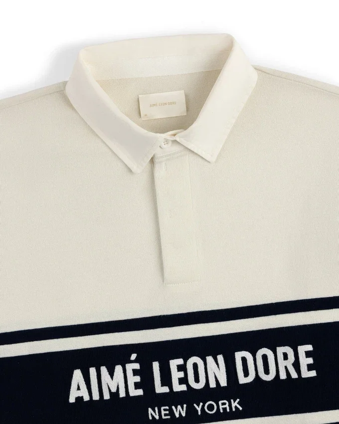 Polo de rugby avec logo rayé sur la poitrine