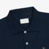 Polo à manches longues en piqué avec écusson