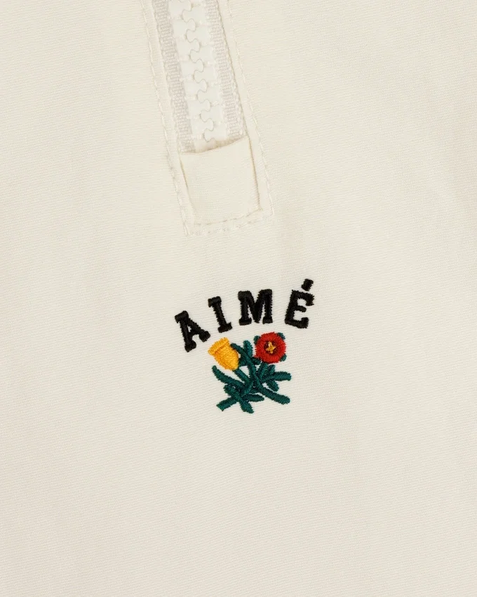 Pull en nylon à demi-zip avec écusson