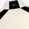 Pull en nylon à demi-zip avec écusson