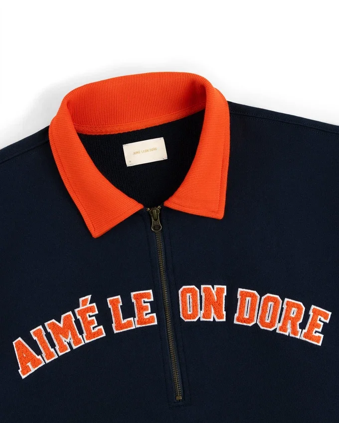 Pull universitaire à quart de zip